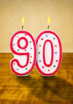 Burning birthday candles number 90