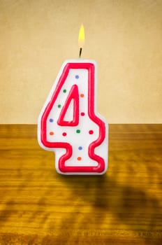Burning birthday candle number 4