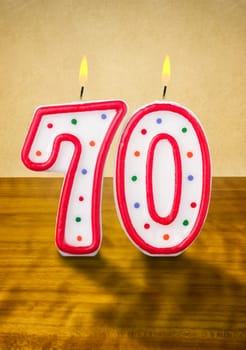 Burning birthday candles number 70