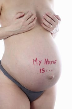 Details of a belly during pregnancy isolated on white background.
