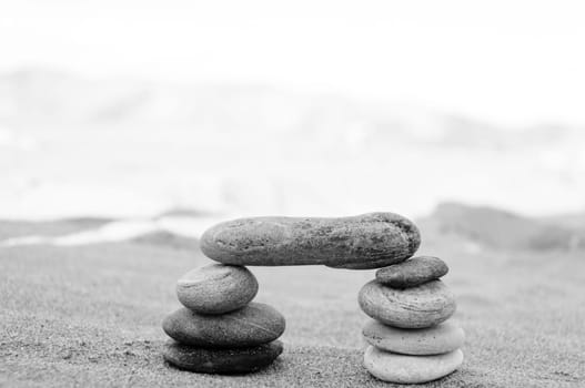 A stack of pebbles in black and white, arch shape, zen concept