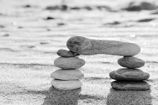 A stack of pebbles in black and white, arch shape, zen concept