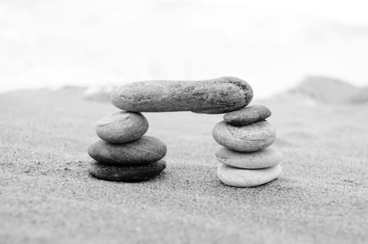 A stack of pebbles in black and white, arch shape, zen concept