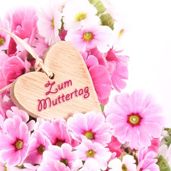 Wooden heart with primroses,Mother's Day