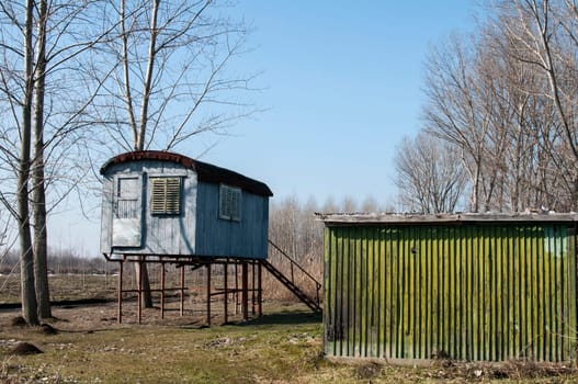 Stilt fisherman bungalow on iron piles in sunny winter day