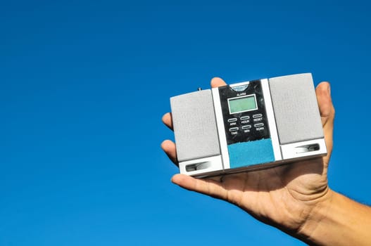 Old Vintage Two Speakers Gray Radio on the blue sky