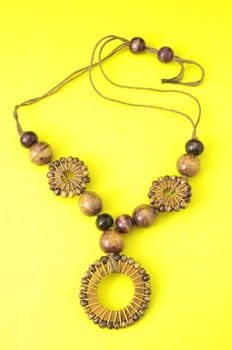 Handmade Wood Collar Necklace on a Colored Background