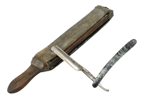 Old (rusty) straight razor with strop isolated on white.