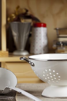 Soup ladle and Seiher sethen on kitchen table