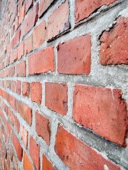 Flat-angle view of a tapered brick wall