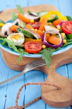 Salad on blue plate