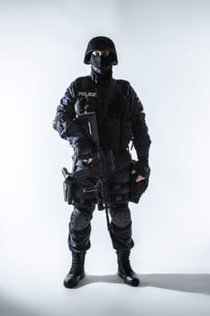 Special weapons and tactics team officer with his gun