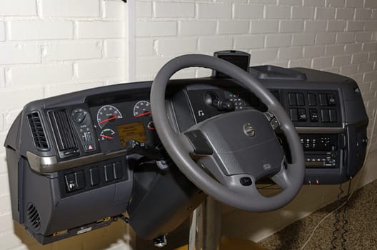 The cockpit of a modern truck with many gauges