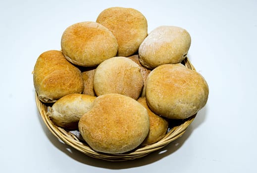 hot breakfast rolls baked with sourdough in a bread basket