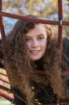A young pretty woman lying in a net