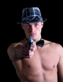 Attractive shirtless young man with black bow-tie and grey fedora hat pointing gut at camera