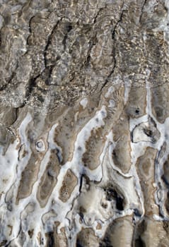 Dead Sea coastline, detail of salt crystals and formations in the sand. Jordan