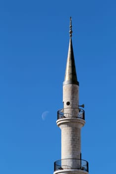Madaba "jesuscristo"" Mosque minaret in blue sky, moon in the background, Jordan"