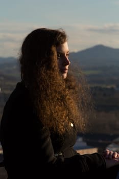 A young pretty woman in front of the panorama of the Siebengebirge