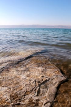 Dead Sea coastline, whit salt crystals and formations in the sand. Jordan