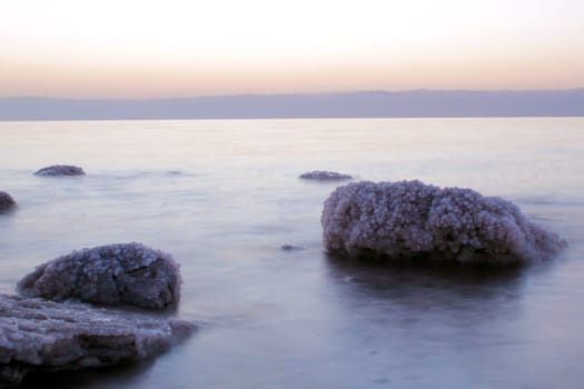 Dead Sea coastline, whit salt crystals and formations in the rocks. Jordan