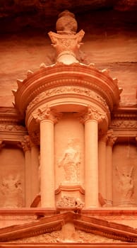 Nabatean architecture detail of "The treasury"" at Petra, Lost rock city of Jordan. Petra's temples, tombs, theaters and other buildings are scattered over 400 square miles. UNESCO world heritage site"