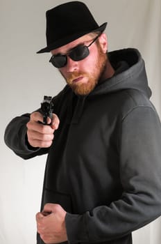 Black Dressed Young Man Holding a Pistol Gun