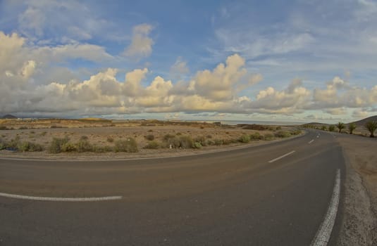 Long Empty Desert Road on a Cludy Day