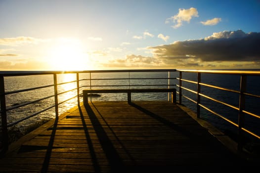 Sunrise on a Pier over Atlantic Ocean in Tenerife Canary Islands Spain