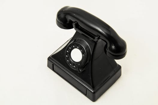Vintage Old Telephone Plastic Black Toy on a White Background