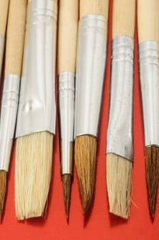 New Wooden Different Paintbrush Set Texture over a Colored Background