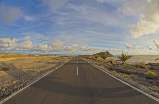 Long Empty Desert Road on a Cludy Day