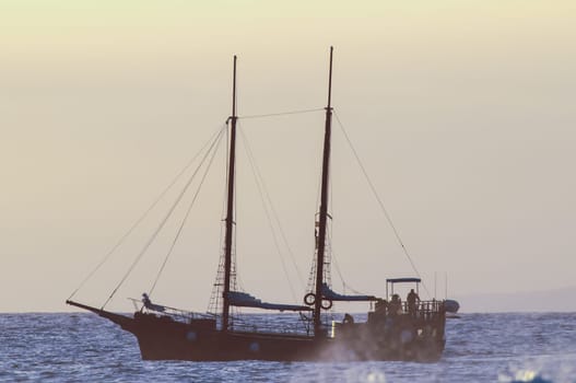 Antique Vintage Sail Vessel on the Ocean at Sunset