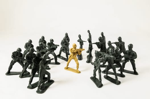 Plastic Lead Soldiers Representing War on a White Background