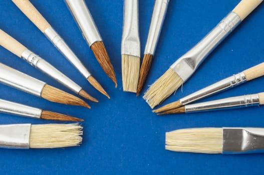 New Wooden Different Paintbrush Set Texture over a Colored Background