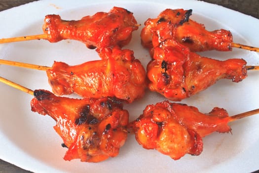 Delicious grilled chicken on a white plate