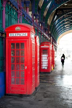 Old red telephone booth in Smithfield meat market in London, UK