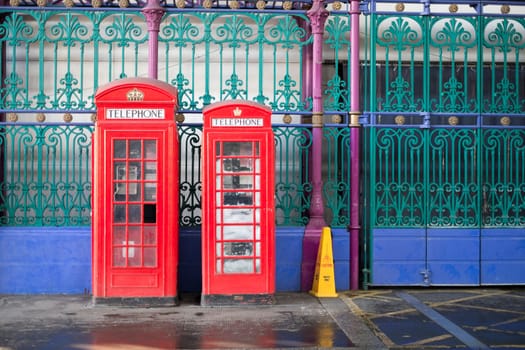 Old red telephone booth in Smithfield meat market in London, UK