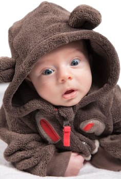 Portrait of 2 months baby boy doing tummy time at home.
