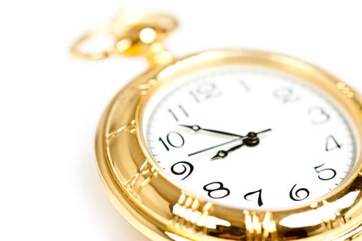 Old styled gold pocket watch on scarlet silk
