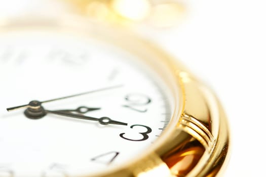 Old styled gold pocket watch on scarlet silk