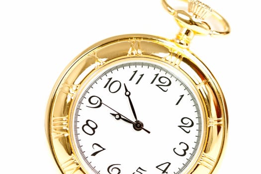 Old styled gold pocket watch on scarlet silk