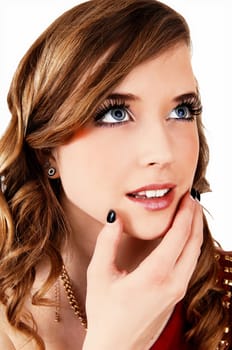 A closeup portrait picture of a young pretty teenager with long curly hair.and blue eyes looking up, for white background..