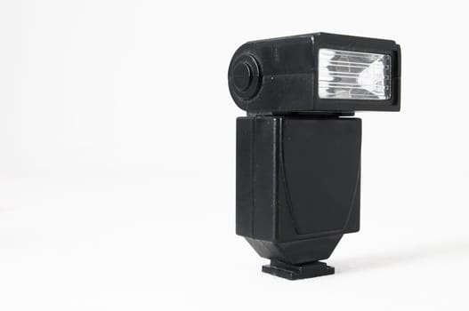 Black Photo Camera Flash on a White Background