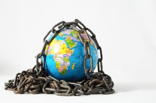 Earth globe close in chain and padlock