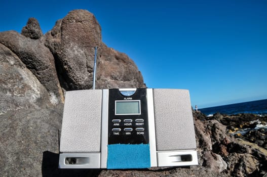 Old Vintage Two Speakers Gray Radio on the Rocks