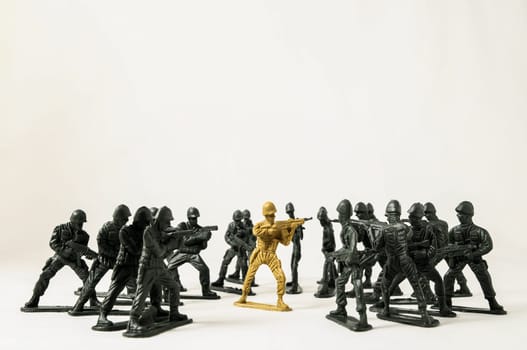 Plastic Lead Soldiers Representing War on a White Background