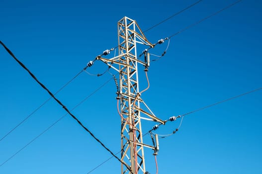 Energy Electricity Power Pylon on a Blue Sky