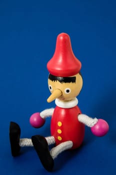 Pinocchio Toy Statue on a Colored Background