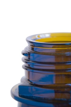Close-up of the bottle opening of a brown laboratory glass bottle against a white background